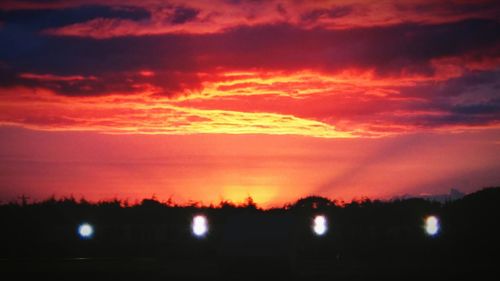 Scenic view of landscape against cloudy sky