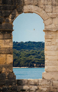 View of mountain seen through arch