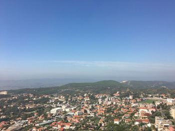 Aerial view of cityscape against clear sky