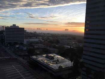 High angle view of city at sunset