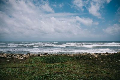 Scenic view of beach and sea against sky