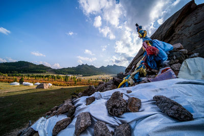 Panoramic view of rocks on land against sky