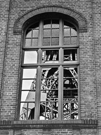 Low angle view of window on wall of building