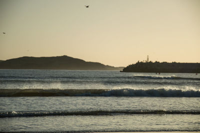 Scenic view of sea against clear sky