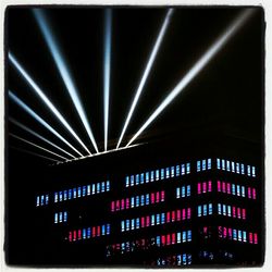 Low angle view of illuminated building at night