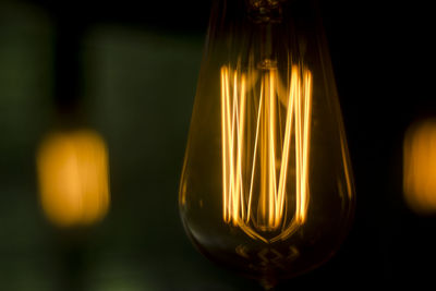 Close-up of illuminated light bulb