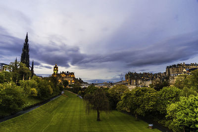 Panoramic view of trees and buildings against sky