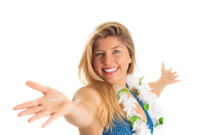 Portrait of a smiling young woman over white background