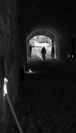 People walking in tunnel