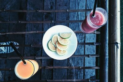 Directly above shot of drinks and fruits on table