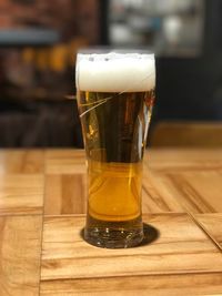 Close-up of beer in glass on table