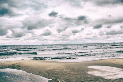 Scenic view of beach against sky