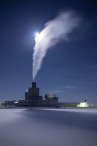 View of factory against sky at night