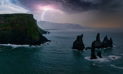 Iceland black sand beach with huge waves at reynisfjara vik.