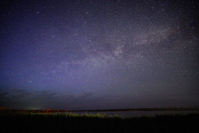 Scenic view of star field against sky at night