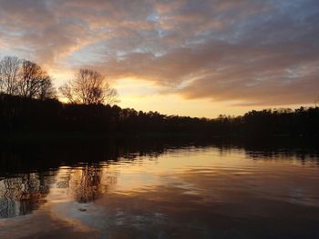 Scenic view of lake at sunset