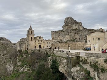 Low angle view of old ruins against sky