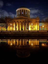 Illuminated buildings in city at night