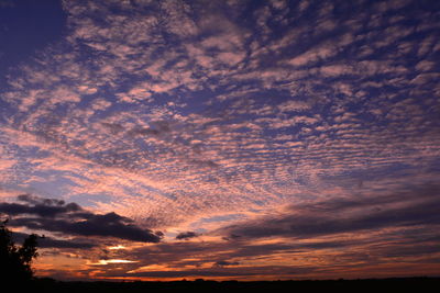 Low angle view of dramatic sky during sunset