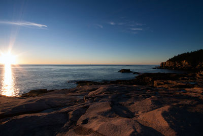 Scenic view of sea at sunset