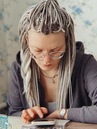 Close-up of woman using mobile phone