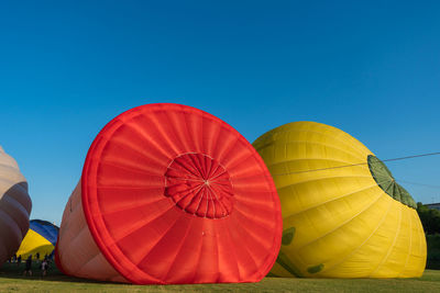 Multi colored hot air balloons against blue sky