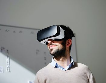 Portrait of man wearing virtual reality glasses