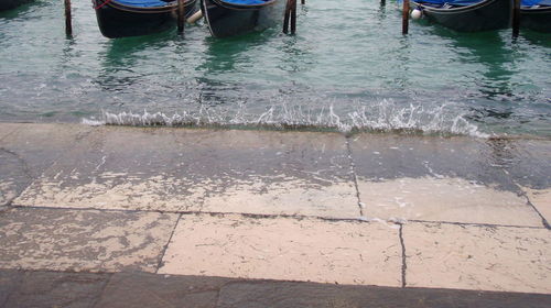 Low section of man standing on sidewalk