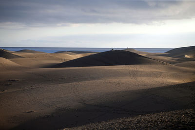 Scenic view of desert against sky