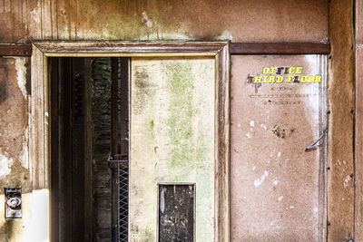 Text on window of old building