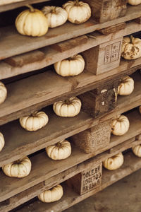 White pumpkin on wooden ground close up
