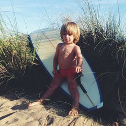 Portrait of child with surfboard