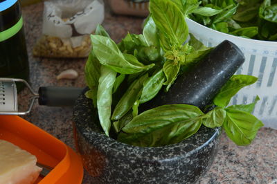 Preparing pesto in mortar