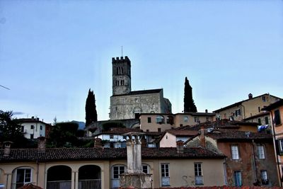 View of buildings in city against sky