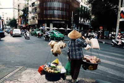 People on sidewalk in city