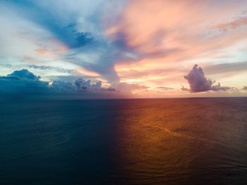 Scenic view of sea against dramatic sky