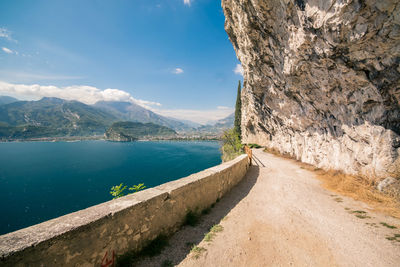 Scenic view of sea and mountains against sky