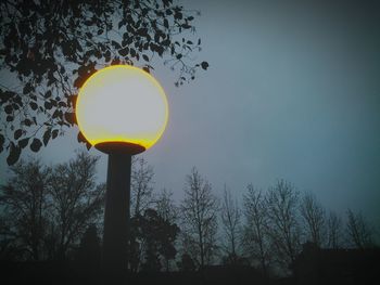 Low angle view of street light against sky