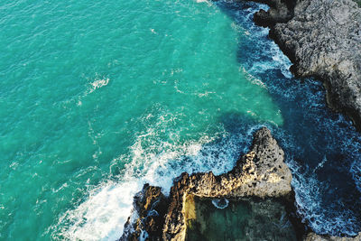 High angle view of rocks in sea