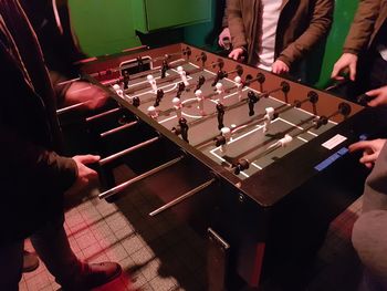 High angle view of men playing foosball