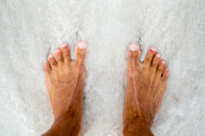 Low section of person wearing shoes