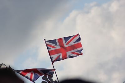 Low angle view of flag against sky