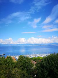 Scenic view of leman lake against blue sky