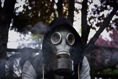 Close-up of man wearing gas mask