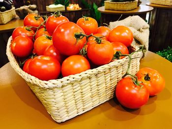 High angle view of tomatoes in basket on table