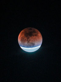 Low angle view of moon against sky at night