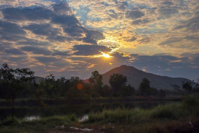 Scenic view of field against sky during sunset