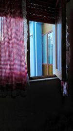 Multi colored curtain against window