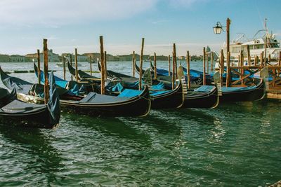 Boats moored in canal