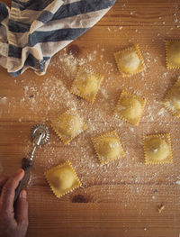 Midsection of person preparing food on table